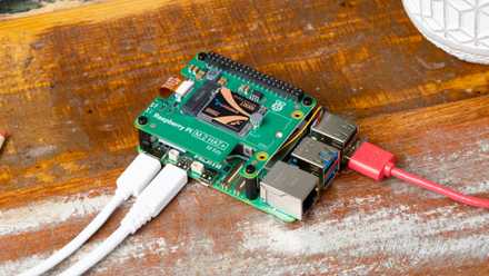 7 causes I am rebuilding my House Assistant setup from scratch this weekend Raspberry Pi computer on a wooden surface with cables connected.