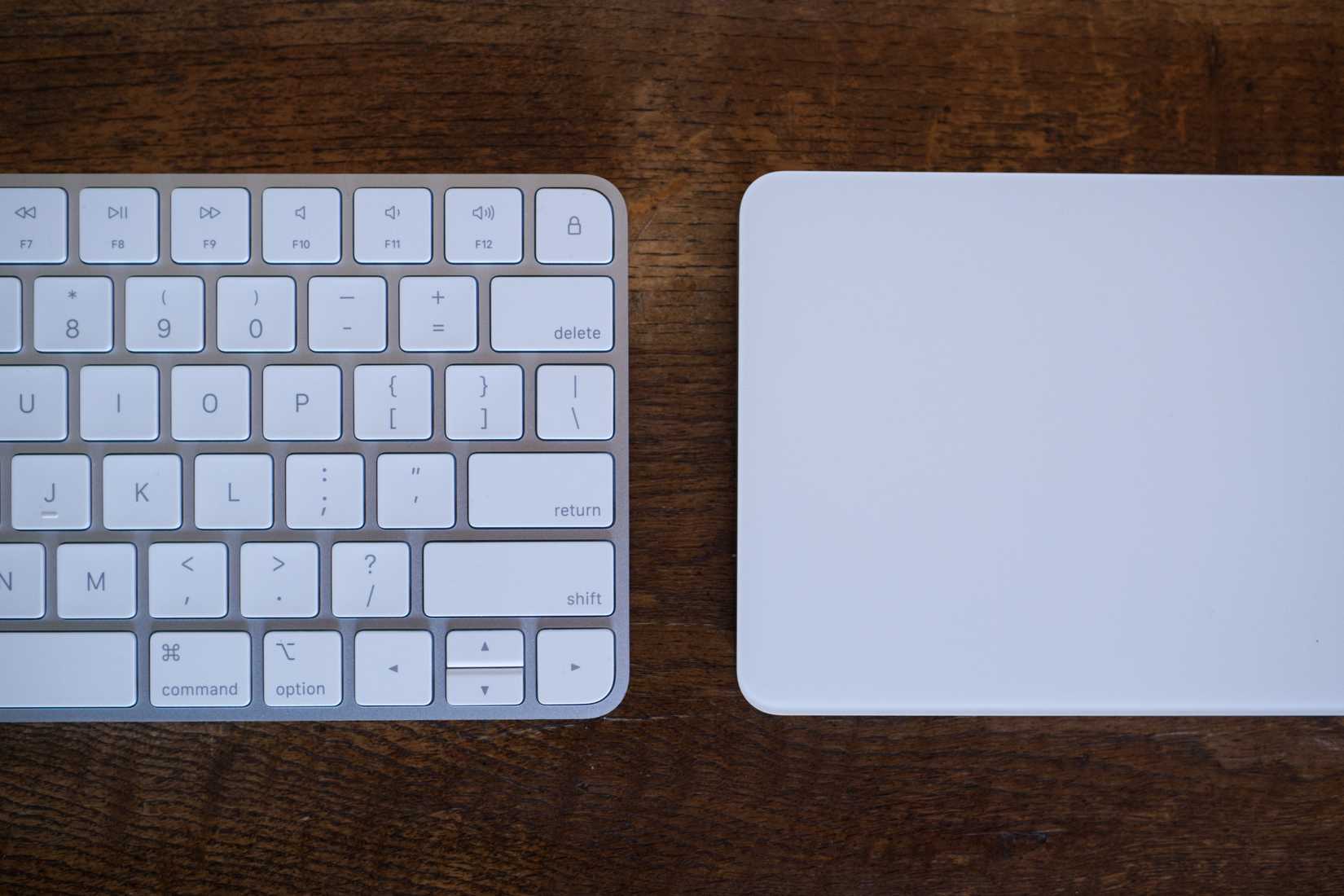 Apple Magic Keyboard and Apple Magic Trackpad side by side.