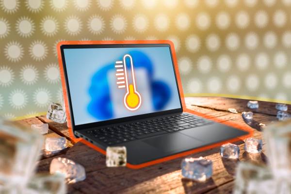 A laptop with a thermometer on the screen surrounded by ice cubes.