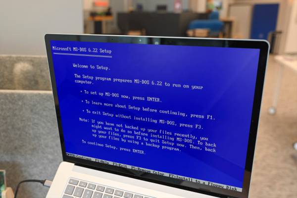 A laptop with MS-DOS screen.