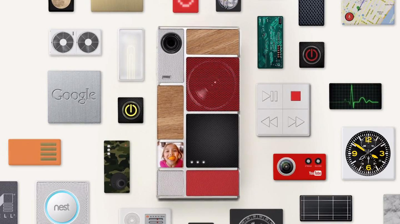 Google Project Ara prototype modular phone with various modules placed around it. 