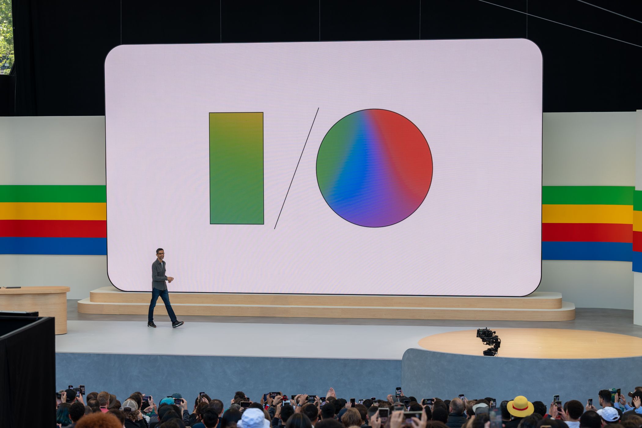 Sundar Pichai walking across the stage at Google IO 2024