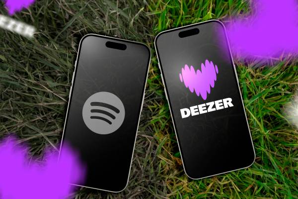 Two phones above a grass field, one with Spotify logo, and the other with Deezer logo.