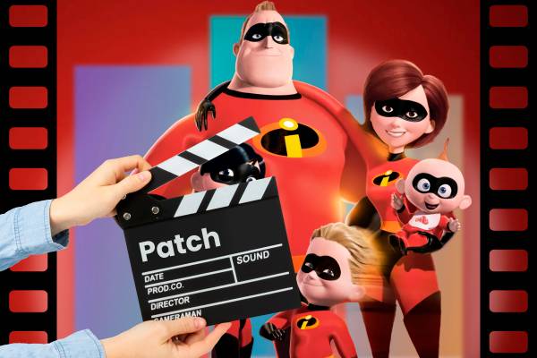 A hand holding a clapperboard with 'path' written on it and an image from the movie 'The Incredibles'.