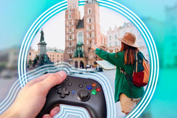 A hand holding a controller and, in the background, a woman exploring a place holding a map.