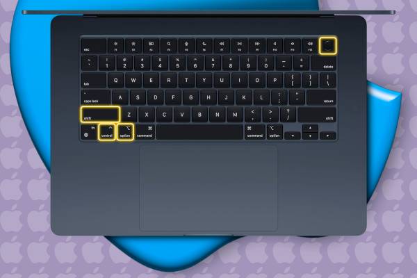 A MacBook with some keys highlighted.