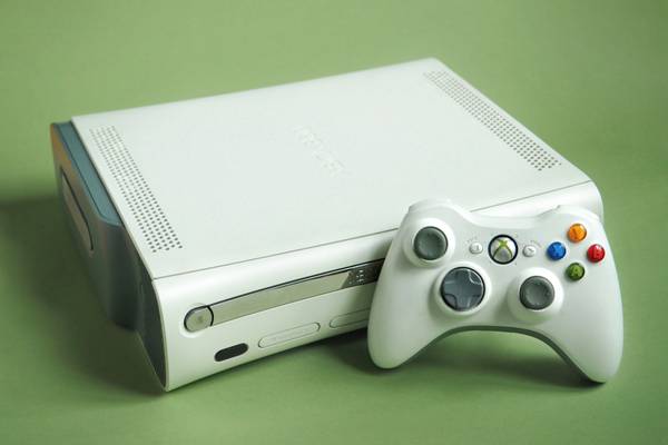 A white Xbox 360 with controller.