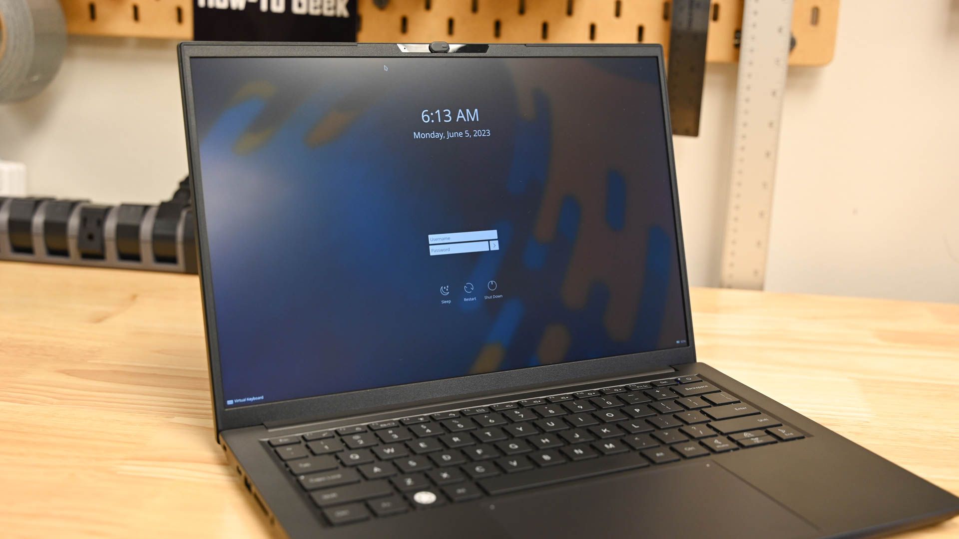 A laptop with the username and password boxes visible. 