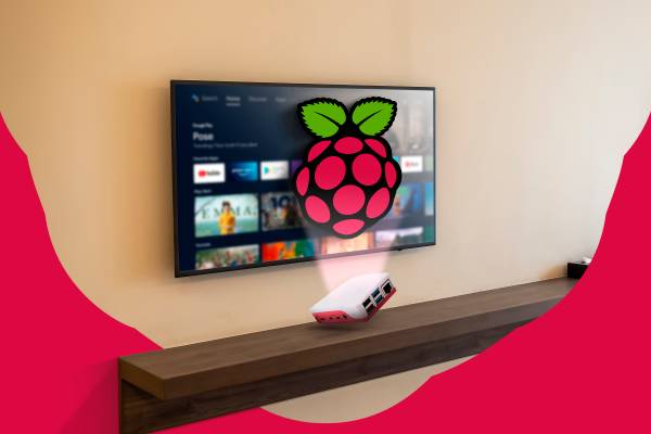 An Android TV above a shelf with a Raspberry Pi and its logo in the center.