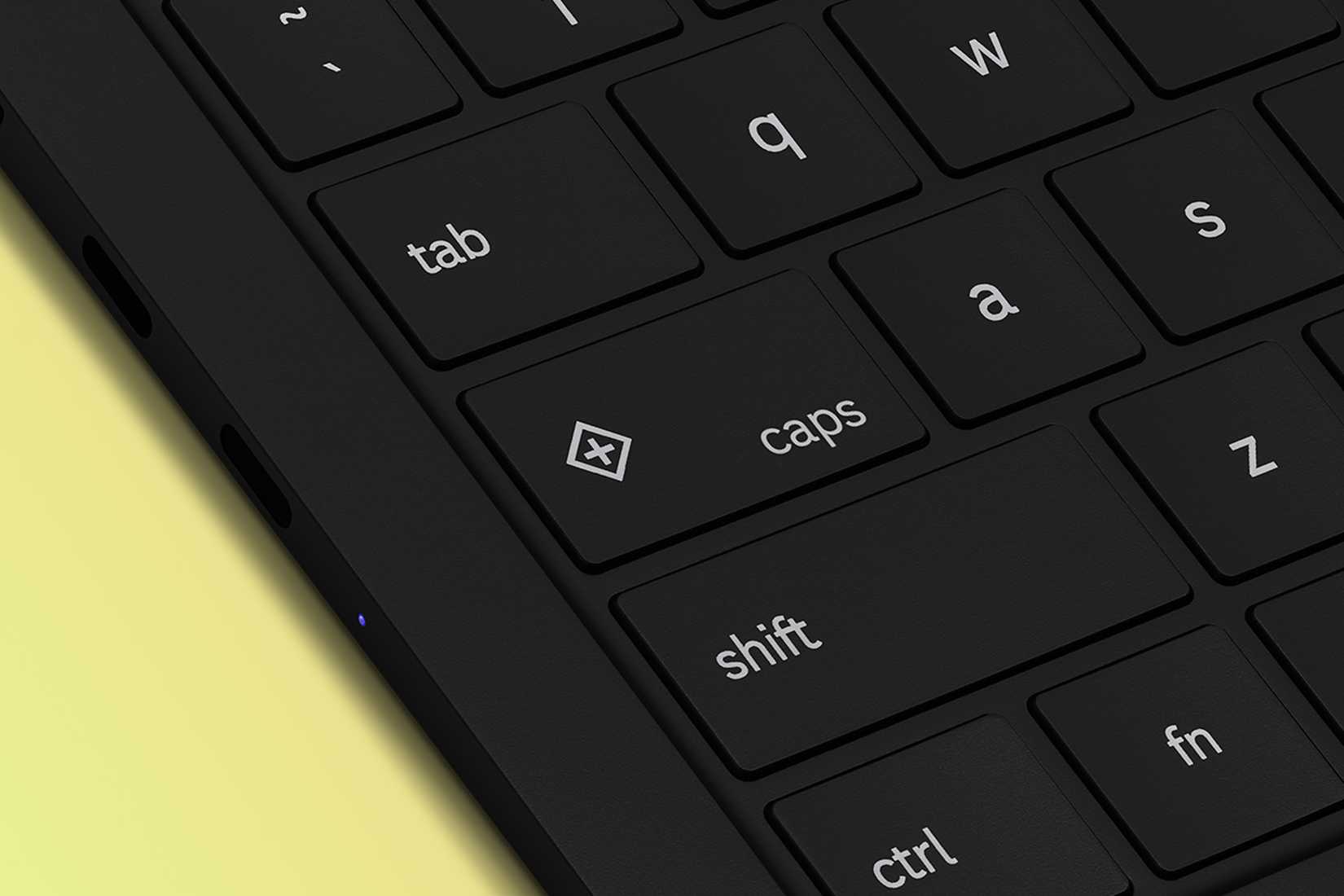 Uma chave de teclado em um laptop com um símbolo de diamante e 