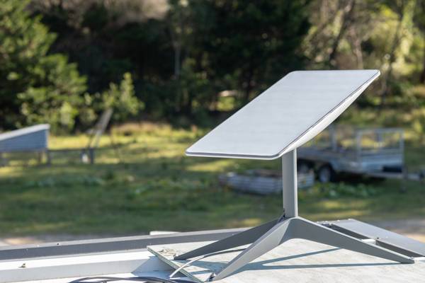 Starlink satellite dish installed on a house roof in rural Australia.