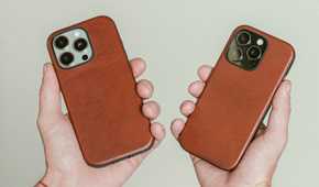 Hands holding the iPhone 16 Pro with a Nomad Olde Dublin leather case.