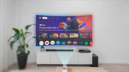 A living room with a projector image in place of the TV