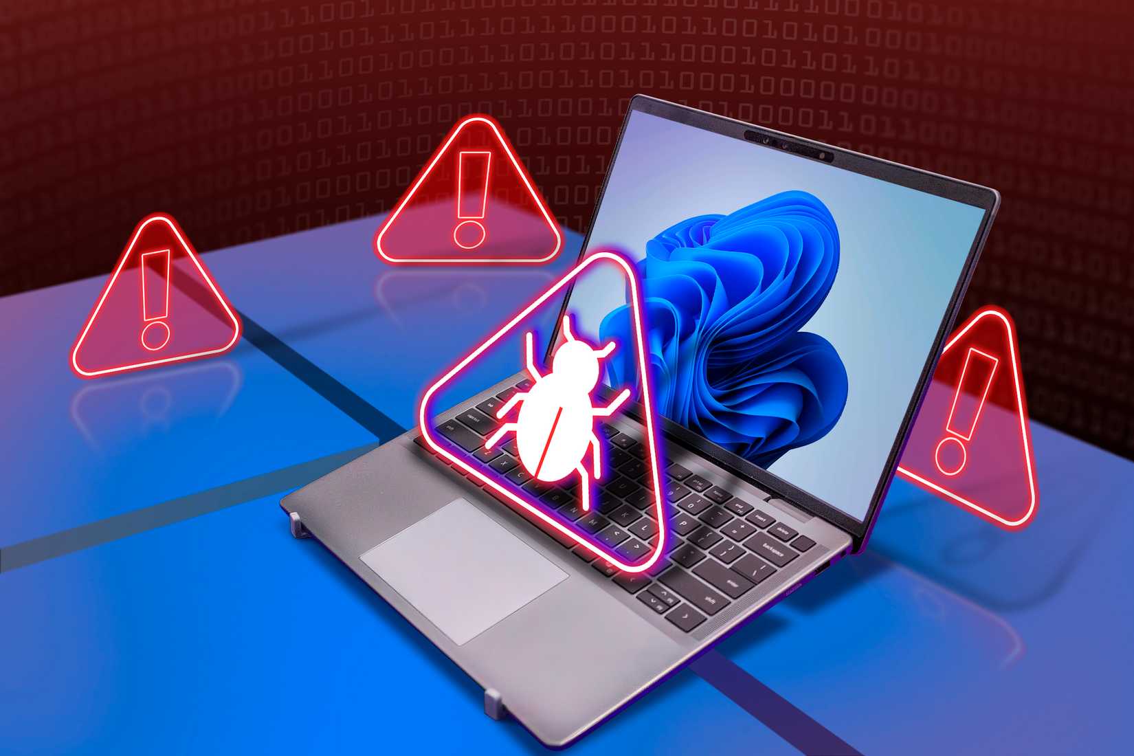 A laptop with Windows 11, a malware icon over the keyboard, and the warning marks around it.