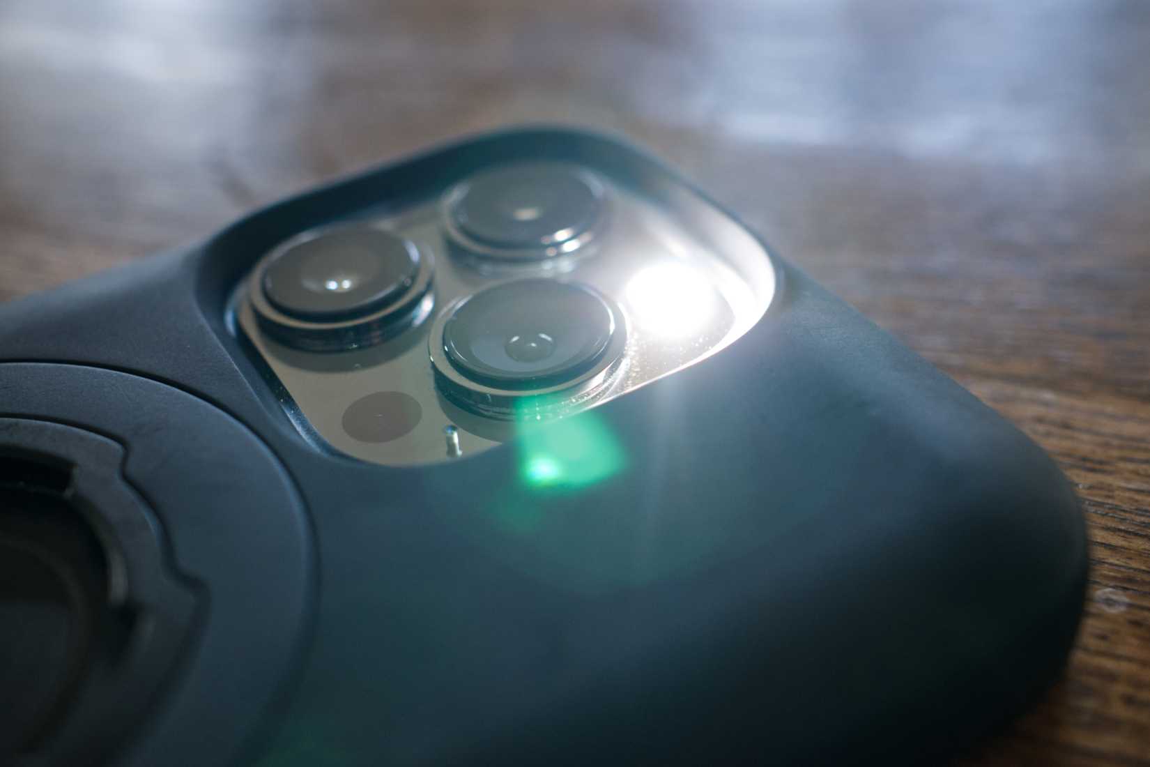 iPhone 13 Pro with flashlight enabled.