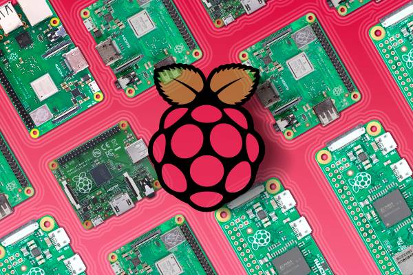 Several Raspberry Pi devices side by side with the logo in the center.