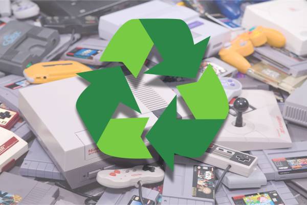 The recycle symbol in front of a bunch of old Nintendo consoles.