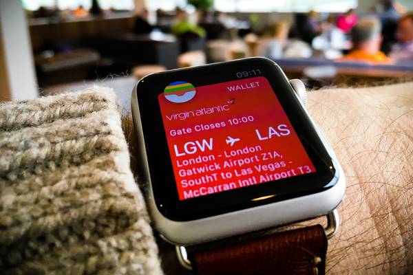 A boarding pass shown on an Apple Watch.