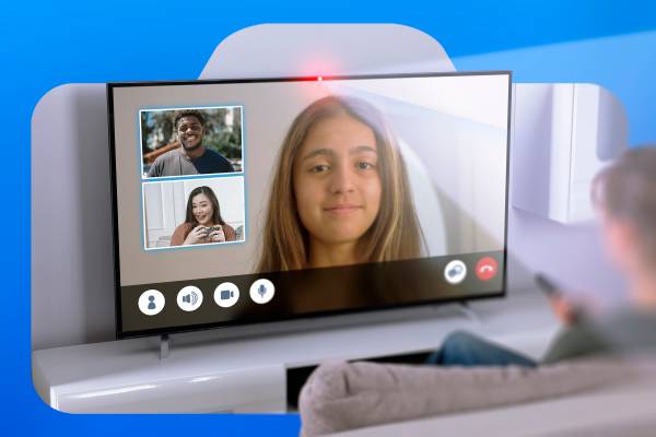 A person in front of a TV on a video call with the camera light on.