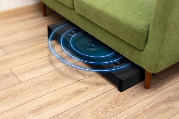 A subwoofer under a couch.