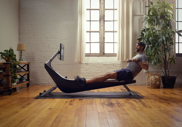 Person using Hydrow rowing machine