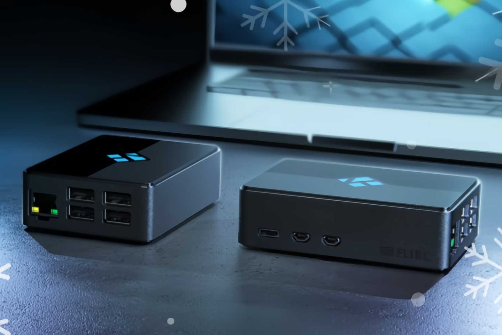 Kodi Limited Edition Raspberry Pi Case next to each other near a laptop