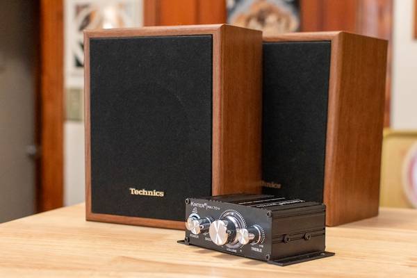 A small Kinter amplifier with a pair of Technics passive speakers.