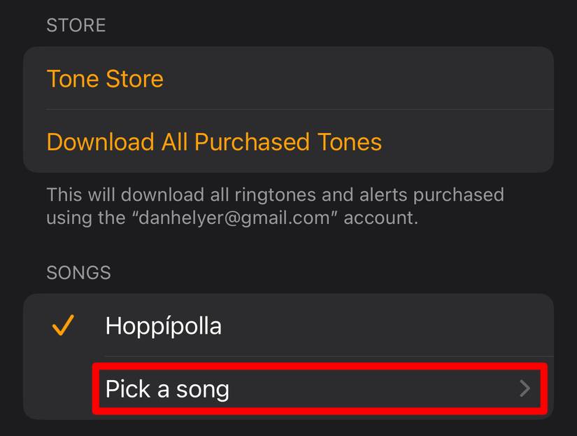 'Pick a song' option in iPhone alarm settings.