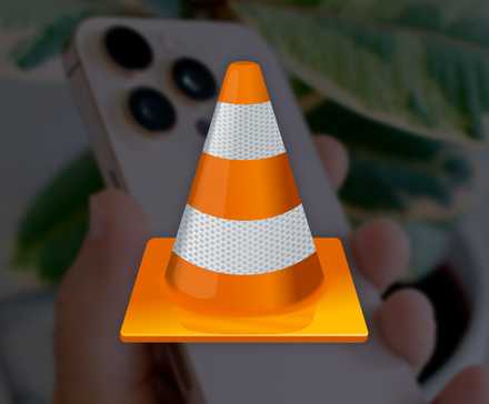 VLC logo in front of an iPhone.