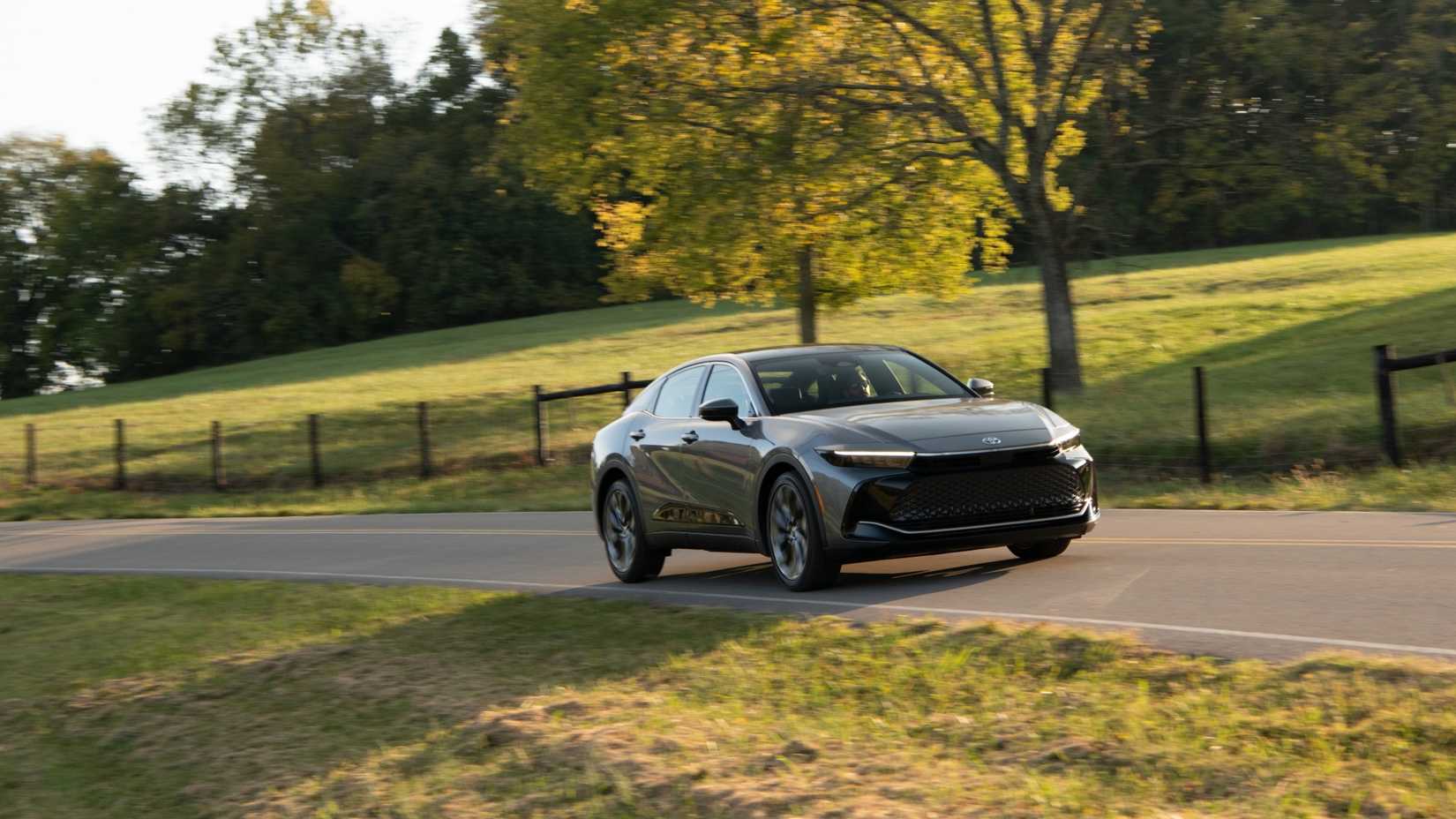Dynamic front 3/4 shot of a gray 2025 Toyota Crown.