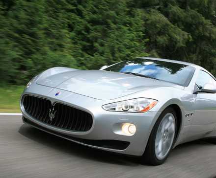 Front 3/4 action shot of a 2008 Maserati GranTurismo