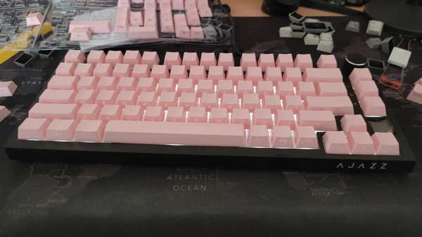 the Ajazz AK820 gasket-mounted keyboard with pink side-printed keycaps.