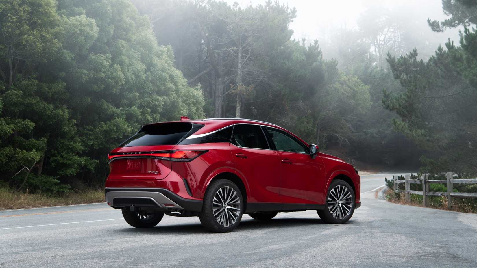 Static rear 3/4 shot of a red 2025 Lexus RX 350h.