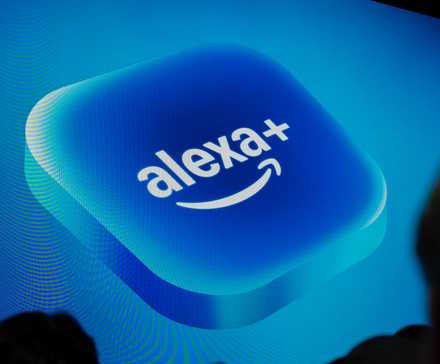 Logo of Alexa+ on a large screen at an event.