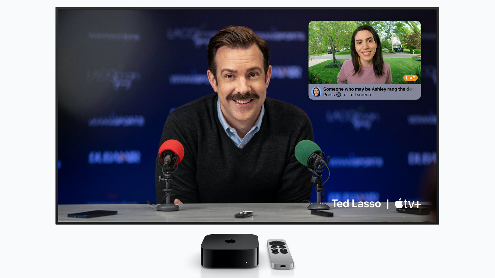 A TV screen showing the output from an Apple TV 4K, with a notification that someone with a recognized face rang the doorbell, superimposed over an episode of Ted Lasso.