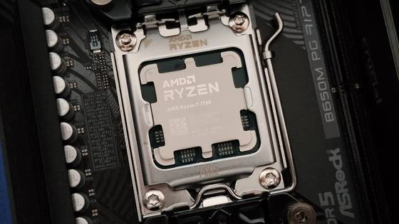 A close-up photo of the AMD Ryzen 7 7700 CPU in the AM5 socket and the ASRock B650M PG RIptide motherboard.