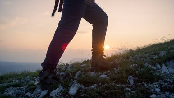 Someone hiking on a mountain.