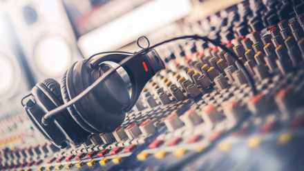 7 techniques an HD Blu-ray is healthier than 4K streaming Mixer and professional headphones in the recording studio. Sound mixing desk. Sound mastering for radio and tv broadcast.