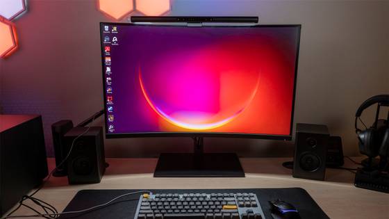 A slightly curved monitor attached to a Windows 11 PC. 