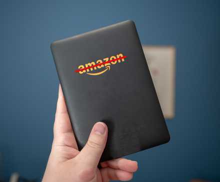 Kindle eReader with Amazon logo crossed out.