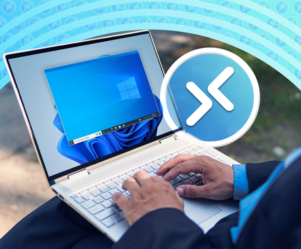 Person using a laptop to control another PC remotely.