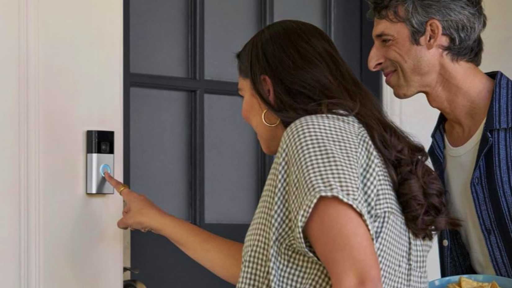 Ring doorbell in use by a woman and a man.