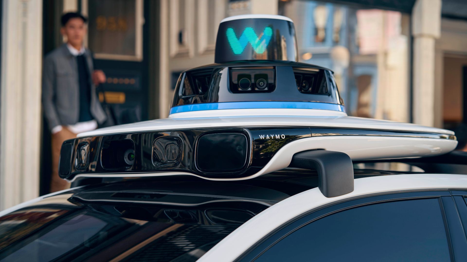 Close-up of the sensors on top of a Waymo Jaguar I-PACE robotaxi.