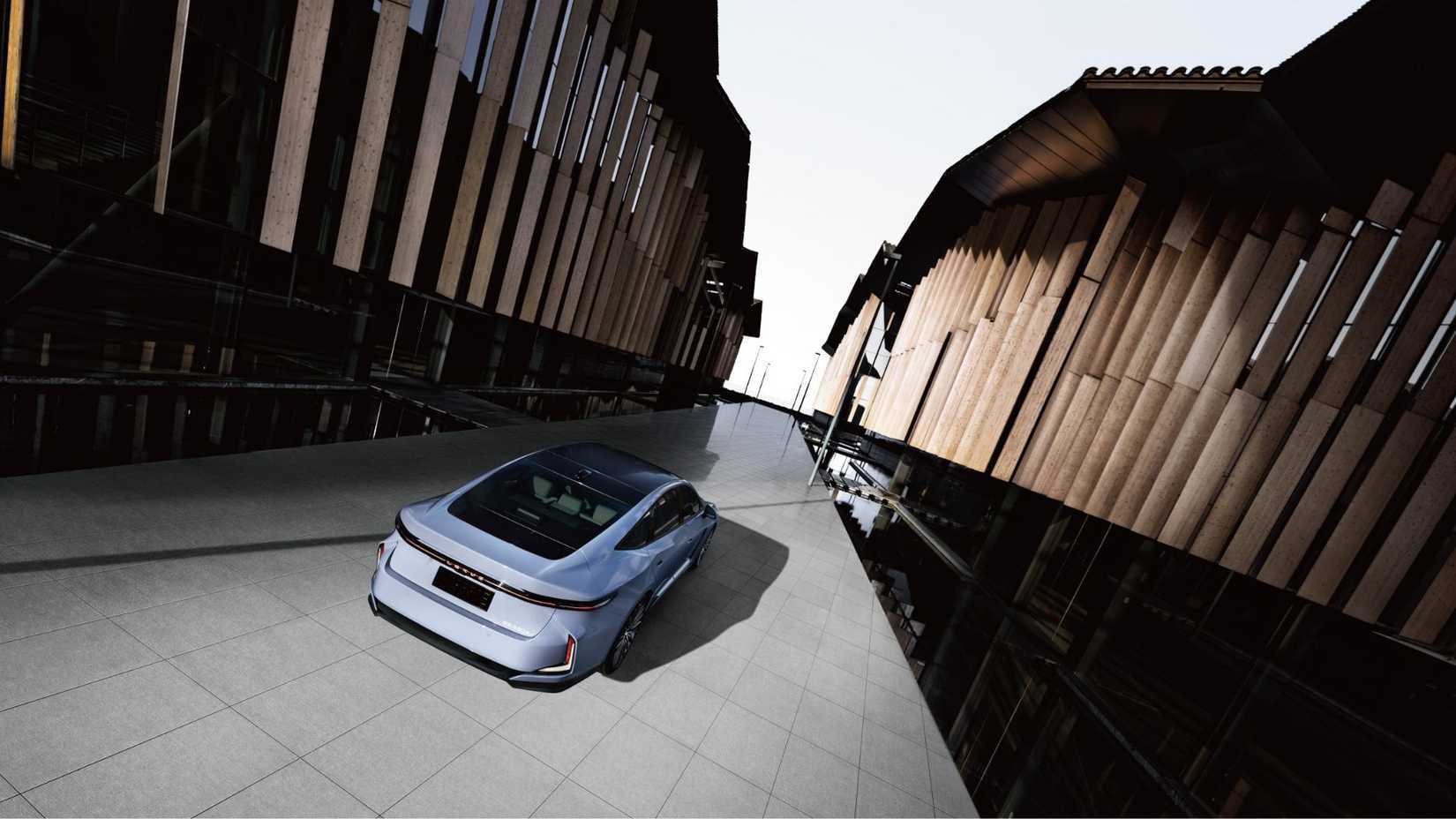 Rear 3/4 shot of the 2026 Lexus ES parked in the shadows.