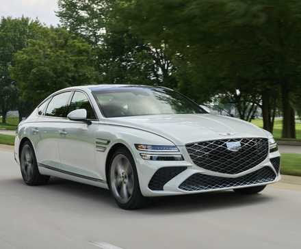 Front 3/4 action shot of a 2025 Genesis G80