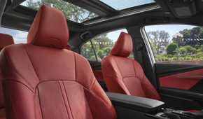 Close-up shot of the red leather seats inside a 2025 Toyota Camry XSE.