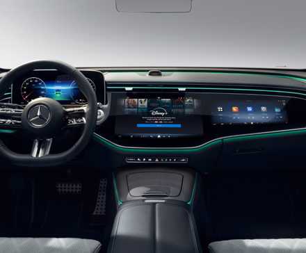 Close-up shot of a Mercedes-Benz interior with the infotainment screen displaying Disney .