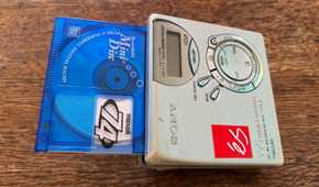 A MiniDisc hanging out of a player.