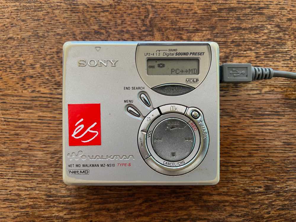 A Sony NetMD player connected to a Mac for file transfers via the Web MiniDisc Project