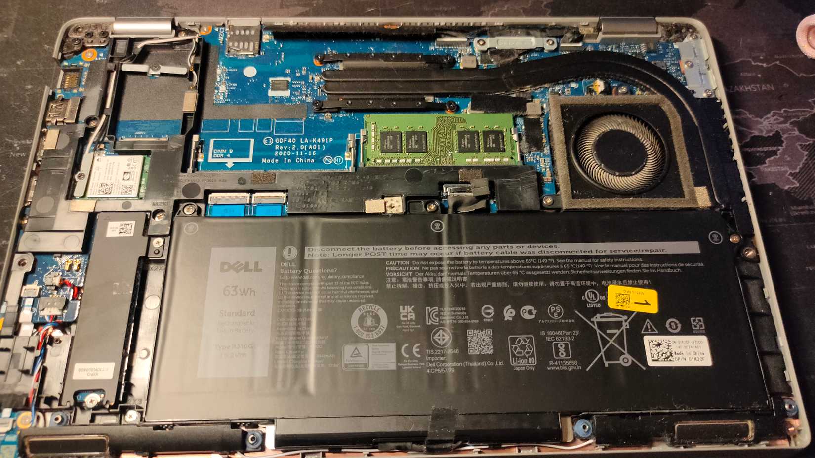Opened Dell Latitude 5420 laptop showing internal components.